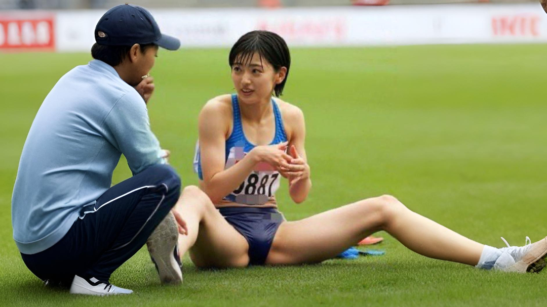 Runner chatting with coach on the grass